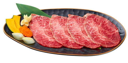 Chuck Eye Sliced is beautifully arranged with a set of vegetables (Slice the pumpkin, garlic, Japanese leeks and carrots) served on a black plate isolated on white background.