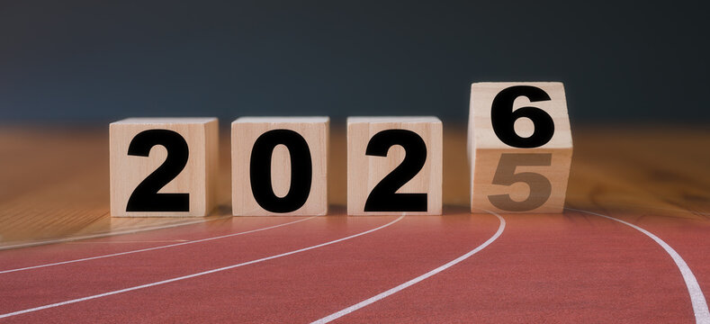 Multi exposure of running track and wooden cube 2025 2026 new year in concept of action business plan targets the new year 2026 growth