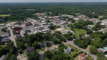 Historic Kingstree, South Carolina downtown buildings, architecture, streets, business, homes in small town USA in the South with shade trees by Black River on Sunny afternoon in summer