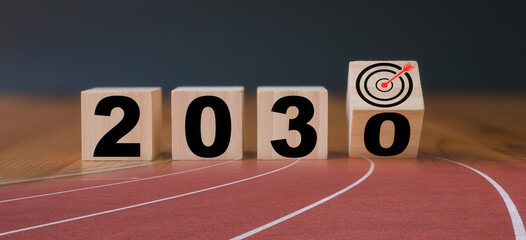 Multi exposure of running track and wooden cube 2030 target board new year in concept of action...