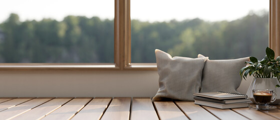 A wooden bench against the window in a minimalist living room on a sunny day.