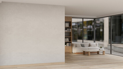 The empty white wall in an apartment corridor leads to a contemporary minimalist living room.