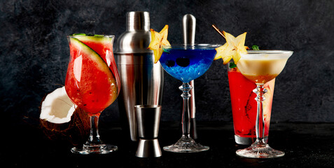 Summer cocktail in glasses on a dark background. Bar delicious drinks