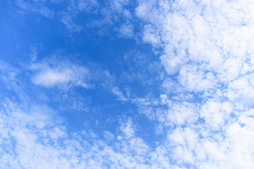 beautiful blue sky and white fluffy group of clouds with sunrise in the morning, natural background