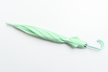 close green umbrella isolated on white background © sutichak