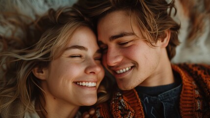 Fototapeta premium The joyful couple reclines, their faces beaming with joy as they gently touch foreheads, expressing deep affection in a serene and comfortable setting. 