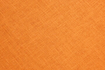 Fototapeta premium orange hemp viscose natural fabric cloth color, sackcloth rough texture of textile fashion abstract background