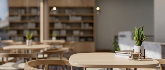 A wooden table with armchairs in a beautiful, contemporary coffee shop or restaurant seating area.