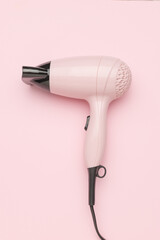 Modern Pink Hair Dryer on Pastel Background - Beauty and Home Appliance Trends