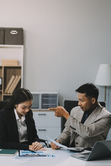 Manager is hard talking with employee in an office. Businessmen arguing at workplace, disagreeing over document, partners having conflict while negotiating, business deal failure