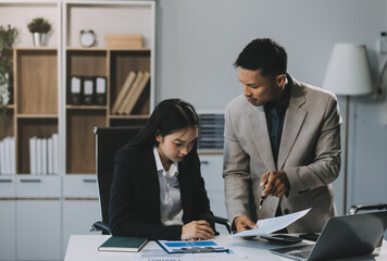 Manager is hard talking with employee in an office. Businessmen arguing at workplace, disagreeing over document, partners having conflict while negotiating, business deal failure