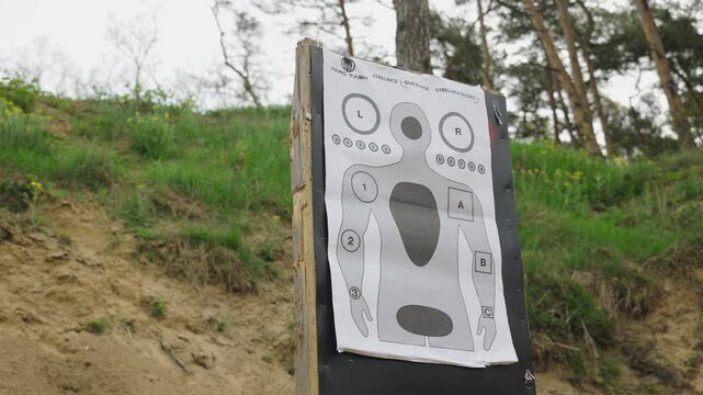 Low angle view of paper target with human silhouette at Olesko shooting range