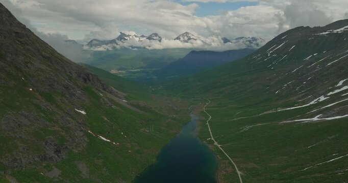 Deep blue lake and mountains in Norway, aerial drone view