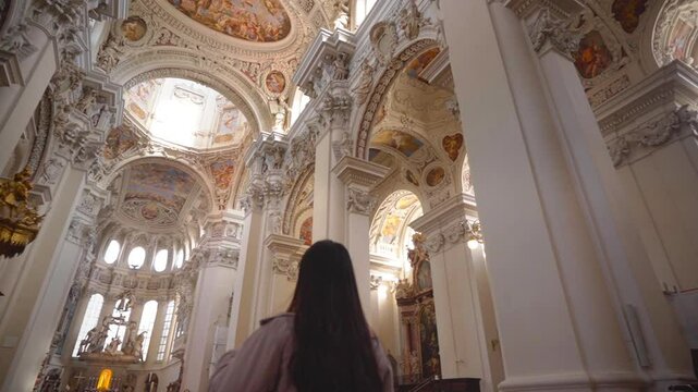 Tourist Inside The Grander St. Stephan's Cathedral Interior In Passau, Germany. Slow Motion Shot