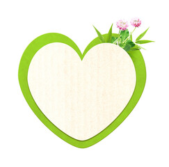 Heart shaped cardboard, flower and leaves. Isolated on white. Sustainable development of strategy...