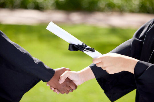 University, handshake and hands of people at graduation with degree for success, achievement and education. College campus, school and students with certification, award and scroll for ceremony