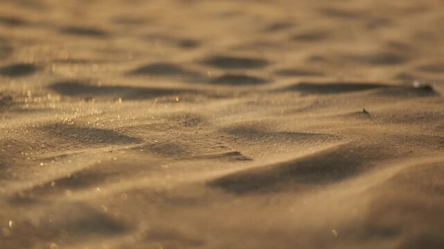 Low close up shot of sand dunes forming in the wind