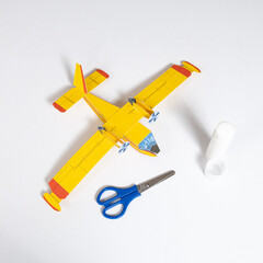 A toy airplane made of paper and glue. Childrens handicraft