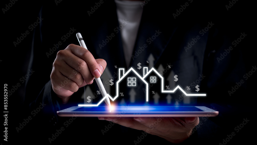 Wall mural businessman analyzing real estate market growth on digital tablet. represents property investment, h