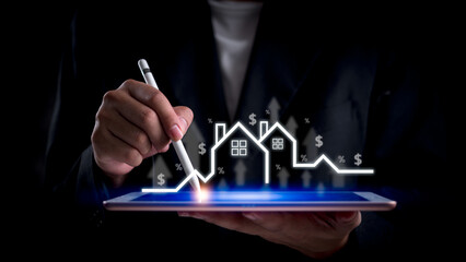 Businessman analyzing real estate market growth on digital tablet. Represents property investment,...