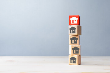 House icons on wooden blocks on the table, copy space