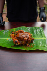 spicy chicken in banana leaf
