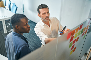 Two man brainstorming in modern office.