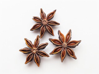 Three star anise pods arranged in a triangular pattern