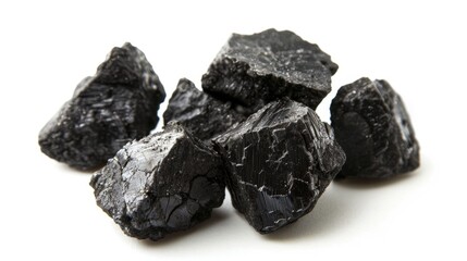 Obraz premium Textured coal chunks representing the carbon on white background