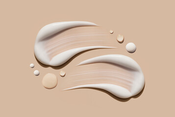 creamy texture of cosmetic samples on a pastel beige background