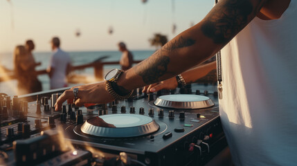 DJ mixing music on console mixer board at a luxury yacht party or at a beach party at sea, close-up of dj hands 