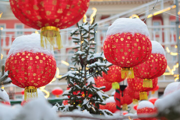 Red Chinese lanterns in the snow. Chinese New Year. Chinese New Year holiday. Without people.