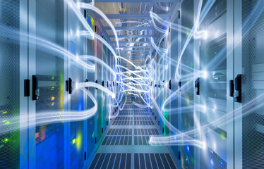 Illuminated network waves in server room of data center