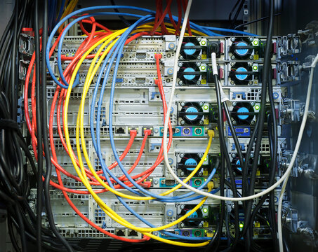 Colorful cables connected to server at data center