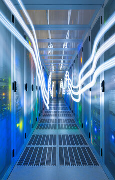 Illuminated network waves in data server room at center