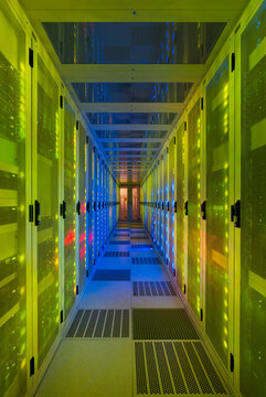 Illuminated server room with big data in center