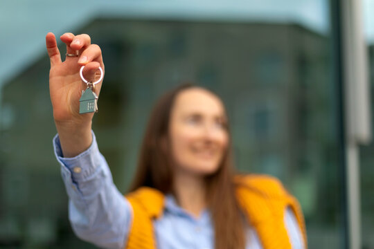 Woman holding house key