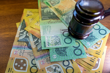 judge hammer with australian dollar money on desk.  Crime corruption concept a