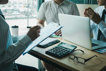 person signing an important business document, showcasing cooperation and legal consent,...