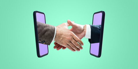 Two hands shaking emerging from phones on a green background, representing a business agreement or digital handshake concept