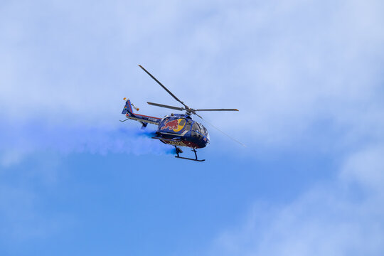Plasy, Czech Republic - April 28, 2024: Day in the Air 2024 (Air Day near Plzeň) - World's best aerobatics with Red Bull B&ouml; 105 helicopter and pilot Siegfried Schwarz from Austria