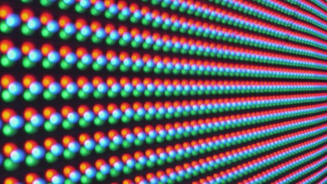 Street advertising billboard screen close-up. Blurred background of many colored circles