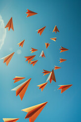 A flock of paper airplanes soaring through the air, symbolizing simple ideas taking flight 