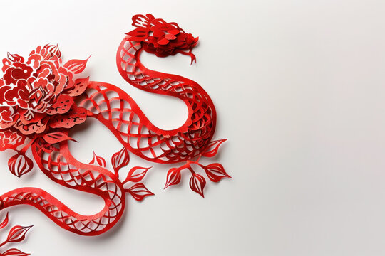 Intricate red paper cut out in the shape of a snake, celebrating the chinese zodiac animal sign for 2025