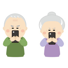 目を凝らしてスマホを見ているシニアの男女