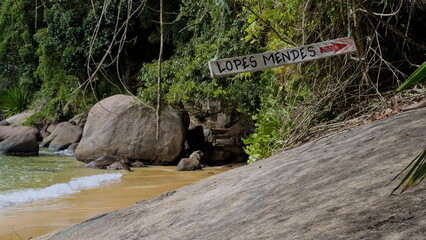 Establishing shot of Lopes Mendes beach sign and sandy shores