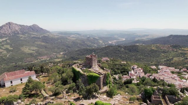 Aerial View of Castle, Mountainous Landscape, historic hilltop with ancient architecture, Castillo del Aguila, Gaucin pueblo, Malaga Spain