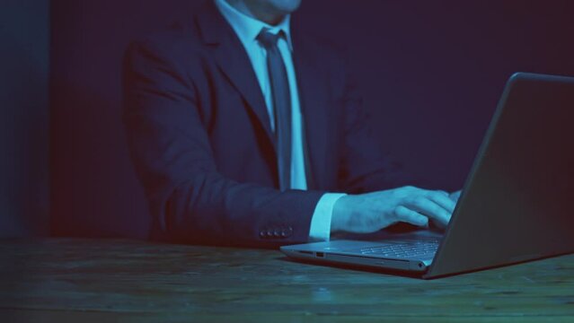 A man in a business suit gestures with his hands explain client case. The hand draws an imaginary exponent curve.
