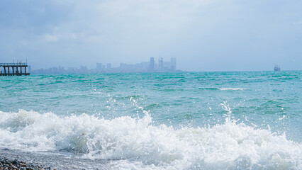 seascape and town in a fog ,blue colours