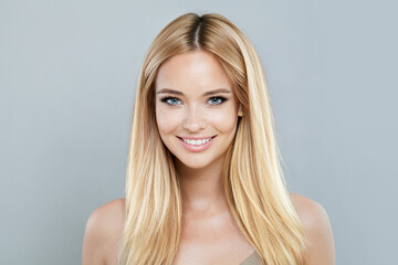 Blonde model woman with natural make-up, healthy skin and long hair. Female beauty, cosmetology and...